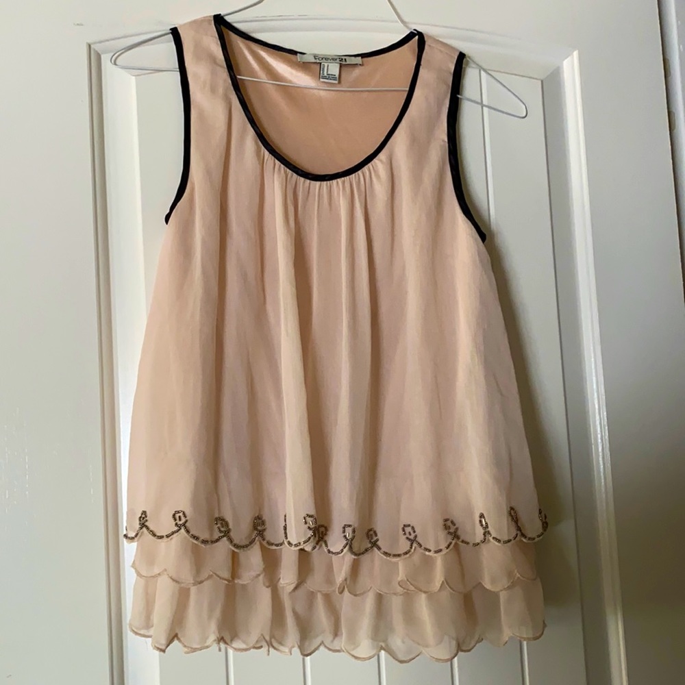 Small woman’s beaded sleeveless blouse